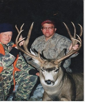 Hunter Holding Deer Antler